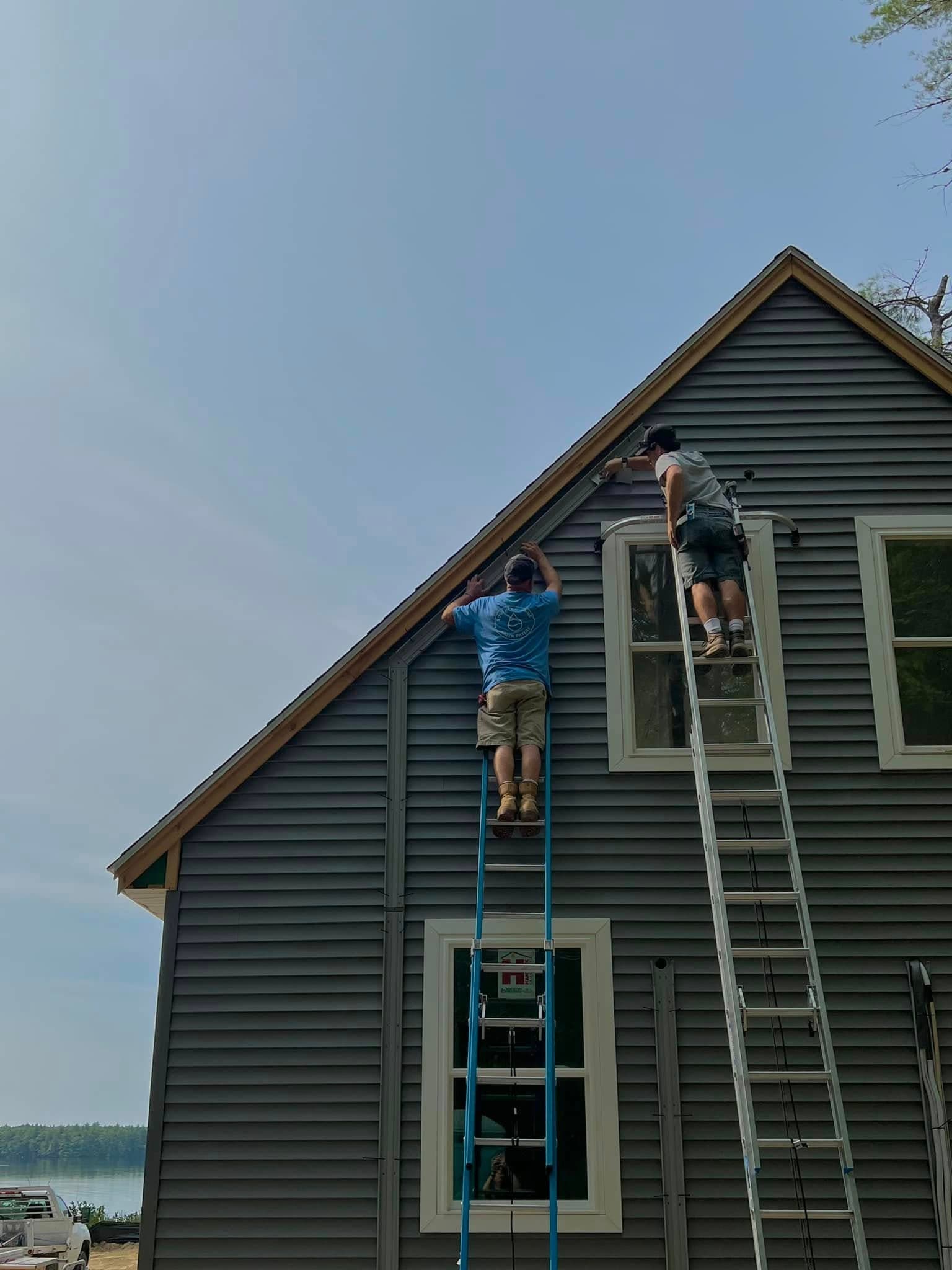 Southern Maine Heat Pumps technician servicing a heat pump outdoor unit