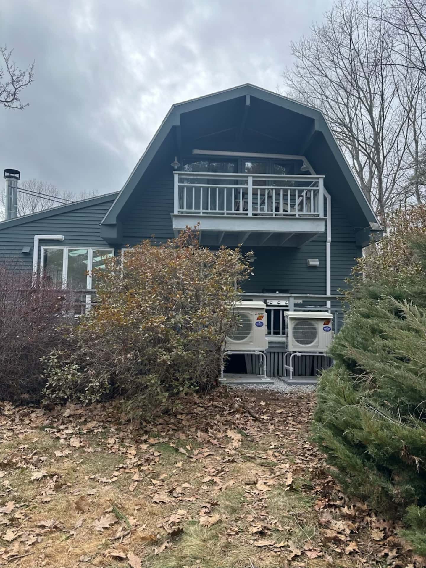 Completed outdoor heat pump installation on the side of a home