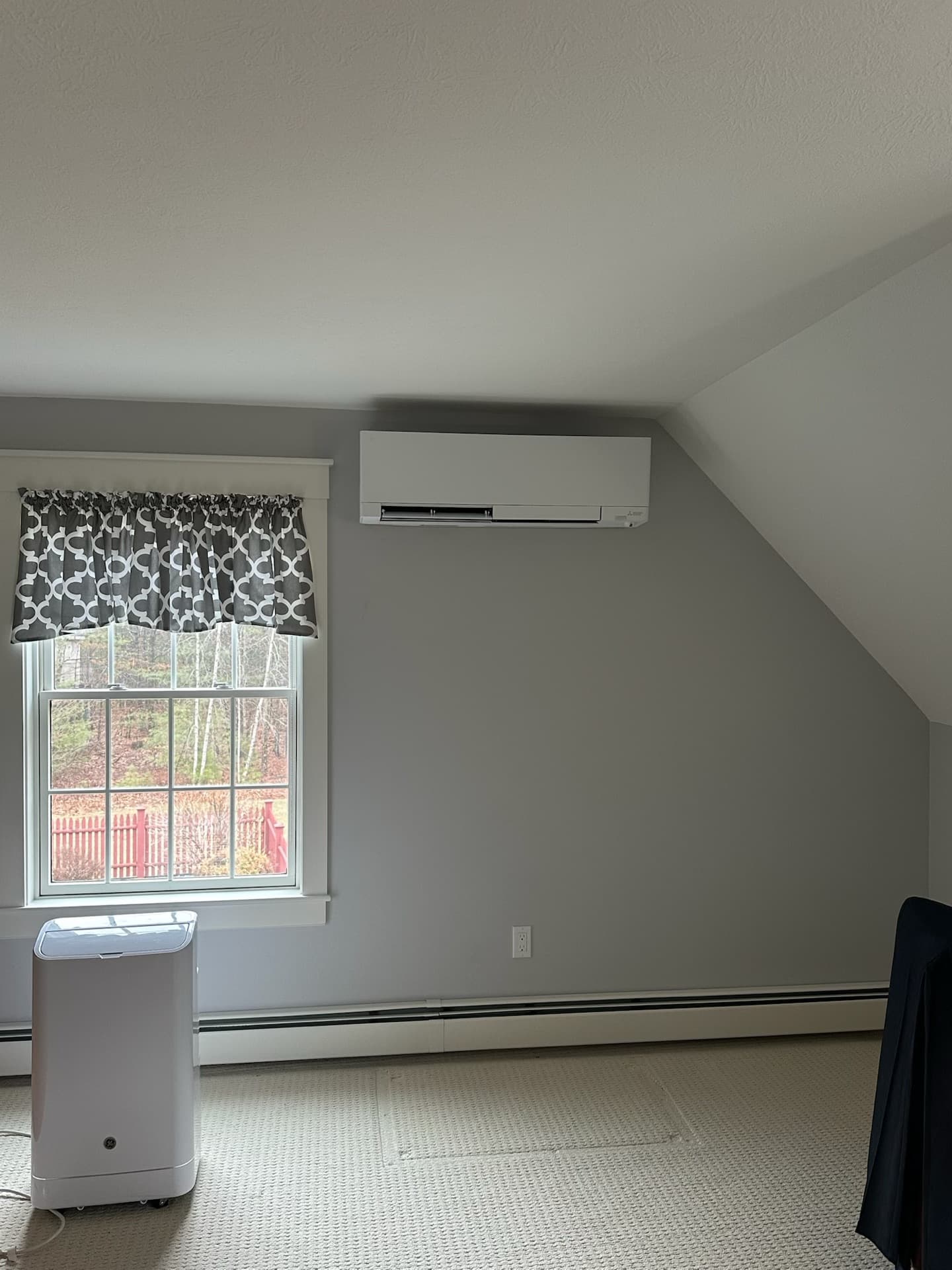 Mini-split installed in a bedroom with vaulted ceiling