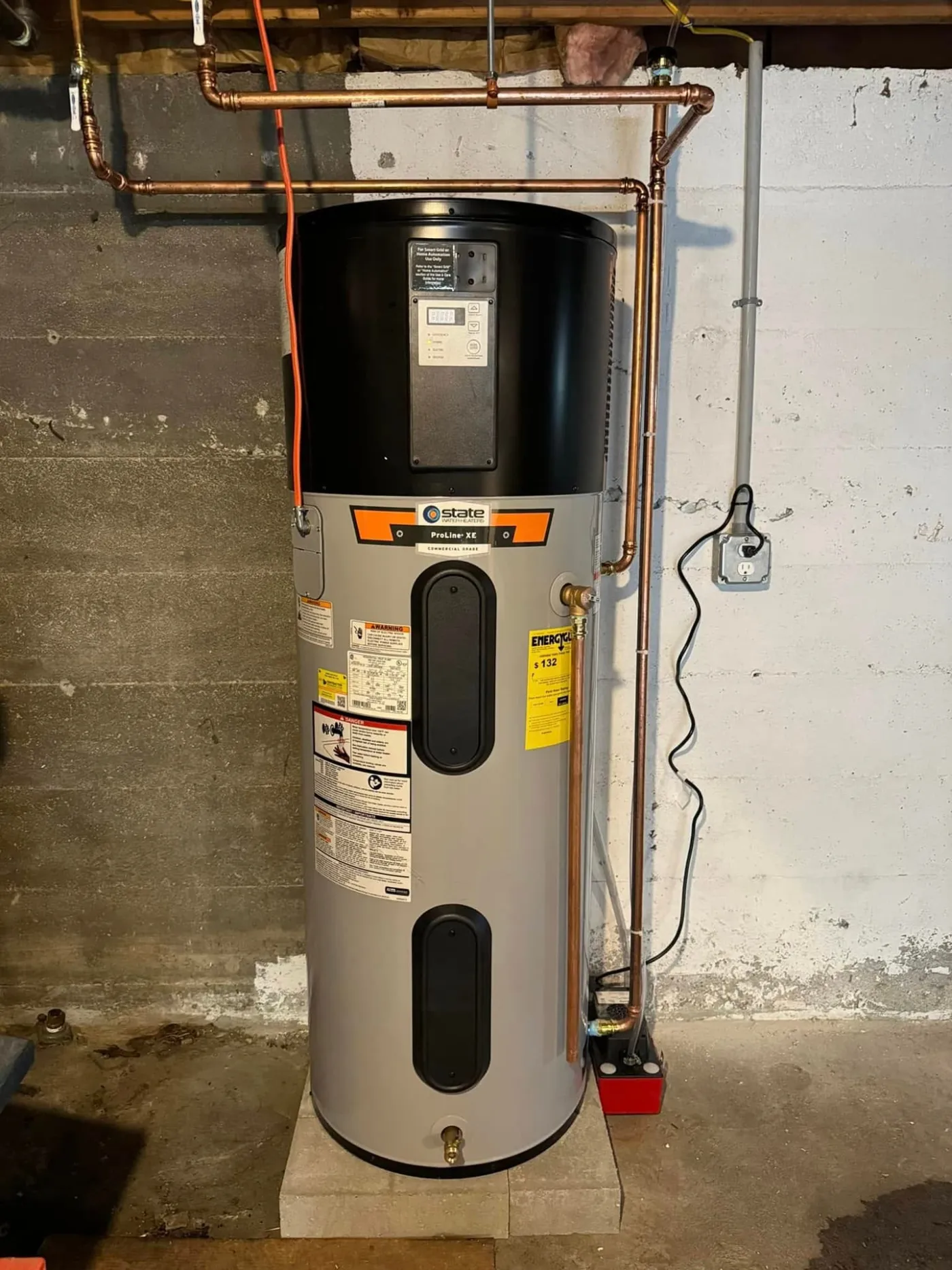 Hybrid heat pump water heater installed in a Southern Maine basement mechanical room