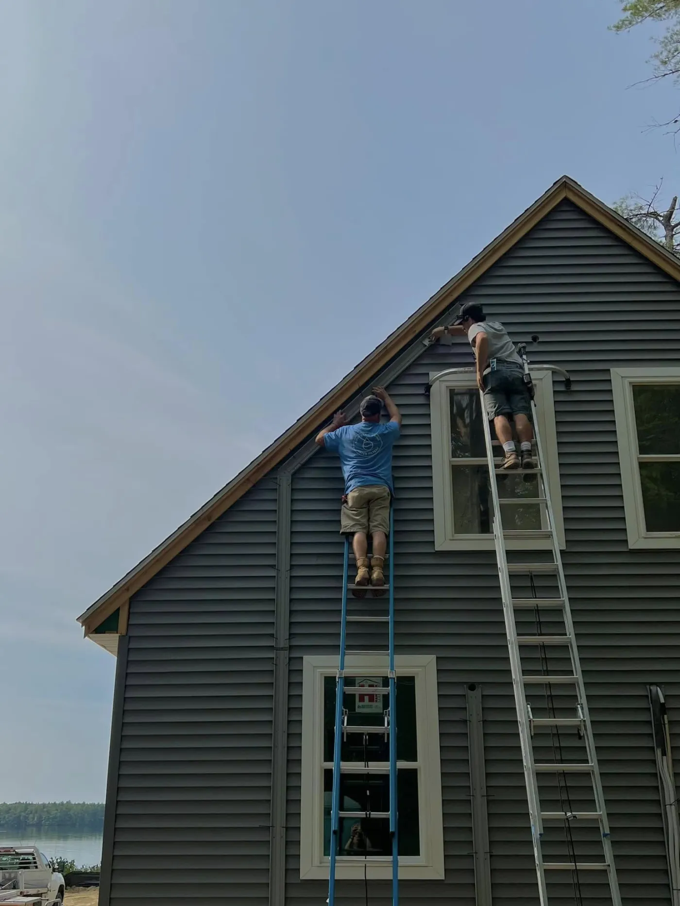 Southern Maine Heat Pumps technician servicing a heat pump outdoor unit