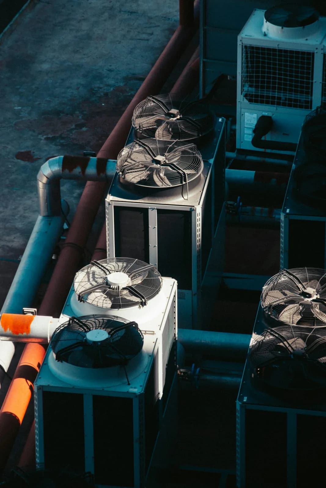 Rooftop bank of commercial condenser and fan units, overhead view